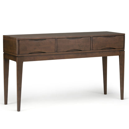 The Harper Handcrafted Console Sofa Table features a dark wood finish, three drawers, and elegant tapered legs, displayed against a white background.