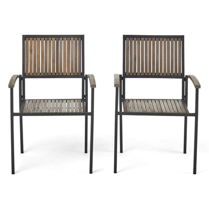 Two Vermilion outdoor dining chairs with vertical slatted wooden seats, backs, and armrests, set side by side on a white background; each features a black metal frame for durability and style.