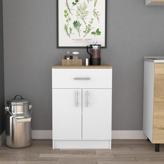 A white Pantry Organizer Cabinet with a light oak top, featuring one drawer, two shelves, and two doors, stands against a gray wall beneath a framed botanical print. A stainless steel milk can sits on the floor to the left.