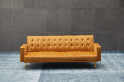 The Comfort Compact Design Sofa Bed, in mustard yellow with tufted upholstery and straight arms, sits on a blue carpet before a gray tiled wall, creating a minimalist contemporary look.