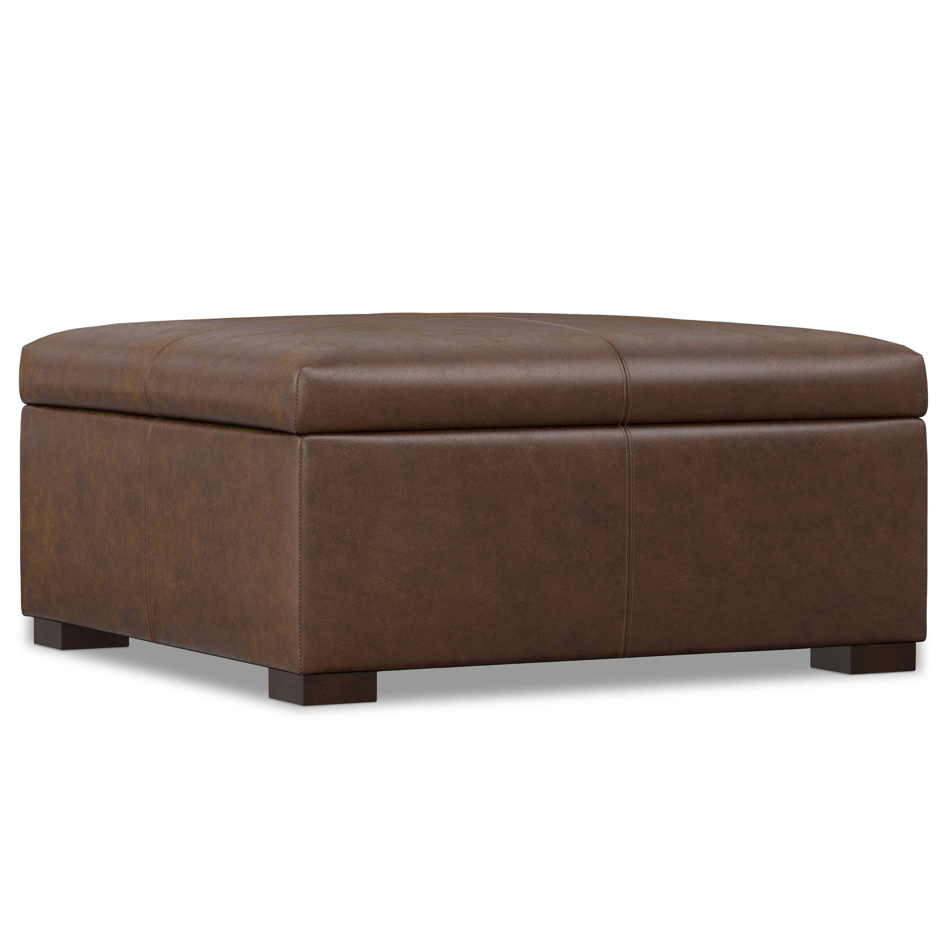 The Gabbie - Coffee Table Upholstered Storage Ottoman is a large, square brown leather piece with a cushioned top and short wooden legs, featuring a modern minimalist design that works as a footrest, coffee table, or for storage.