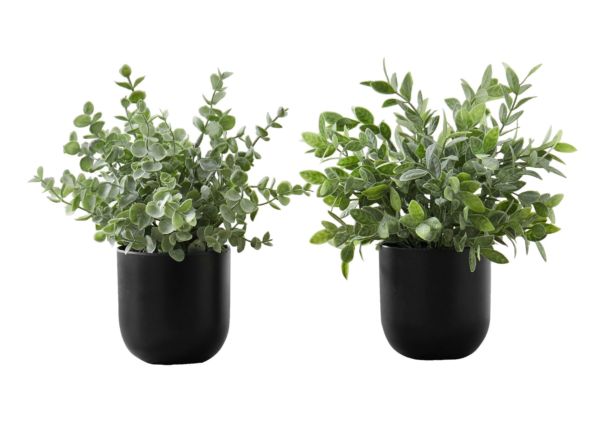 A set of two 11" tall artificial eucalyptus grass plants with lush green foliage in black pots, perfect for indoor table decor. Each faux plant comes potted and ready to display as decorative greenery for your space.