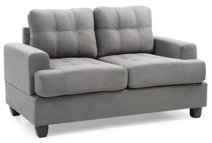The Stylish Transitional Loveseat For Two features soft gray fabric upholstery, tufted back and seat cushions, wide armrests, short black legs, and a boxy contemporary design.