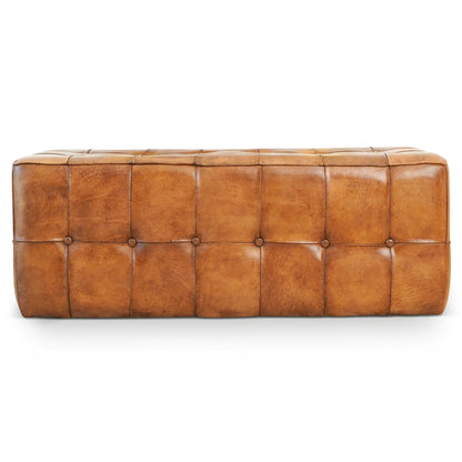 The Benjiro Bench in tan features a rectangular tufted design with visible stitching and button details, upholstered in caramel brown leather and set against a white background.