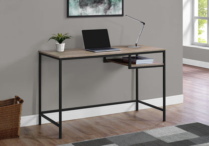 A Computer Desk For Home Office with a compact modern design and contemporary style features a wood top and black metal frame against a gray wall, with a laptop, desk lamp, potted plant, and natural light from a nearby window.