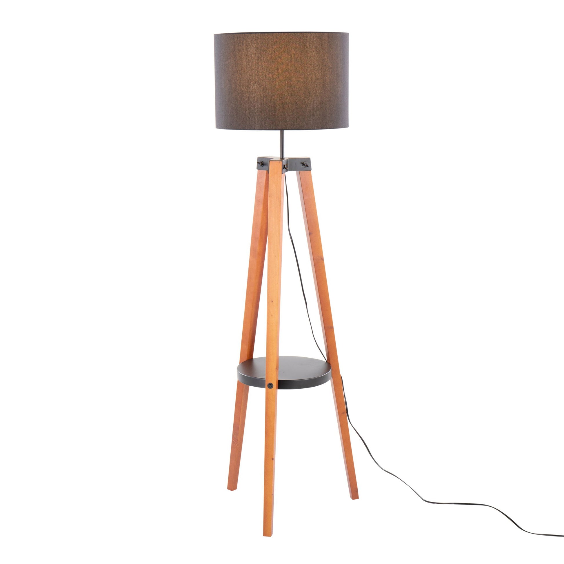 The Compass Mid Century Modern Floor Lamp features a brown cylindrical shade, three wooden tripod legs, a round black shelf midway, and a visible black power cord.