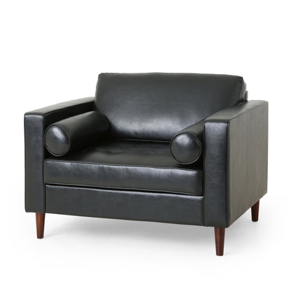 The Sophisticated Club Chair With Relaxing Comfort features modern black leather, square arms, a tufted seat, two bolster pillows, and wooden legs, shown against a plain white background.