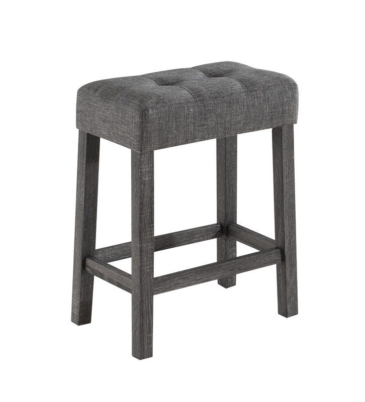 The Lux 3 Piece Counter Height Pub Table set features modern gray tufted linen stools with cushioned seats and dark wood legs connected by support bars.