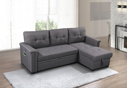 The Ashlyn Reversible Sleeper Sectional Sofa with Storage Chaise, USB charging ports, and pocket is featured on a light gray rug in a bright living room with wood flooring and contemporary decor.