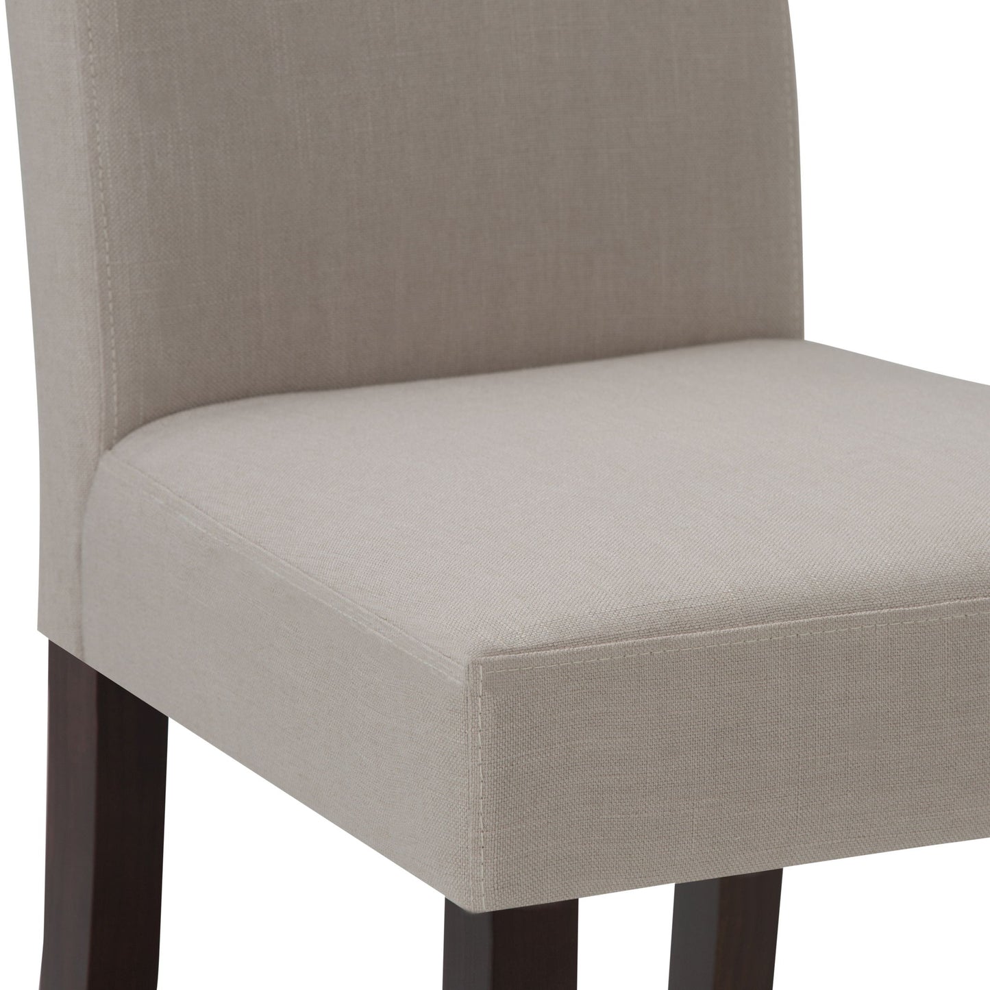 Close-up of the Acadian - Upholstered Parson Dining Chair (Set of 2), showing its light beige upholstered seat and lower backrest with dark wooden legs. Only the seat and lower backrest are visible.