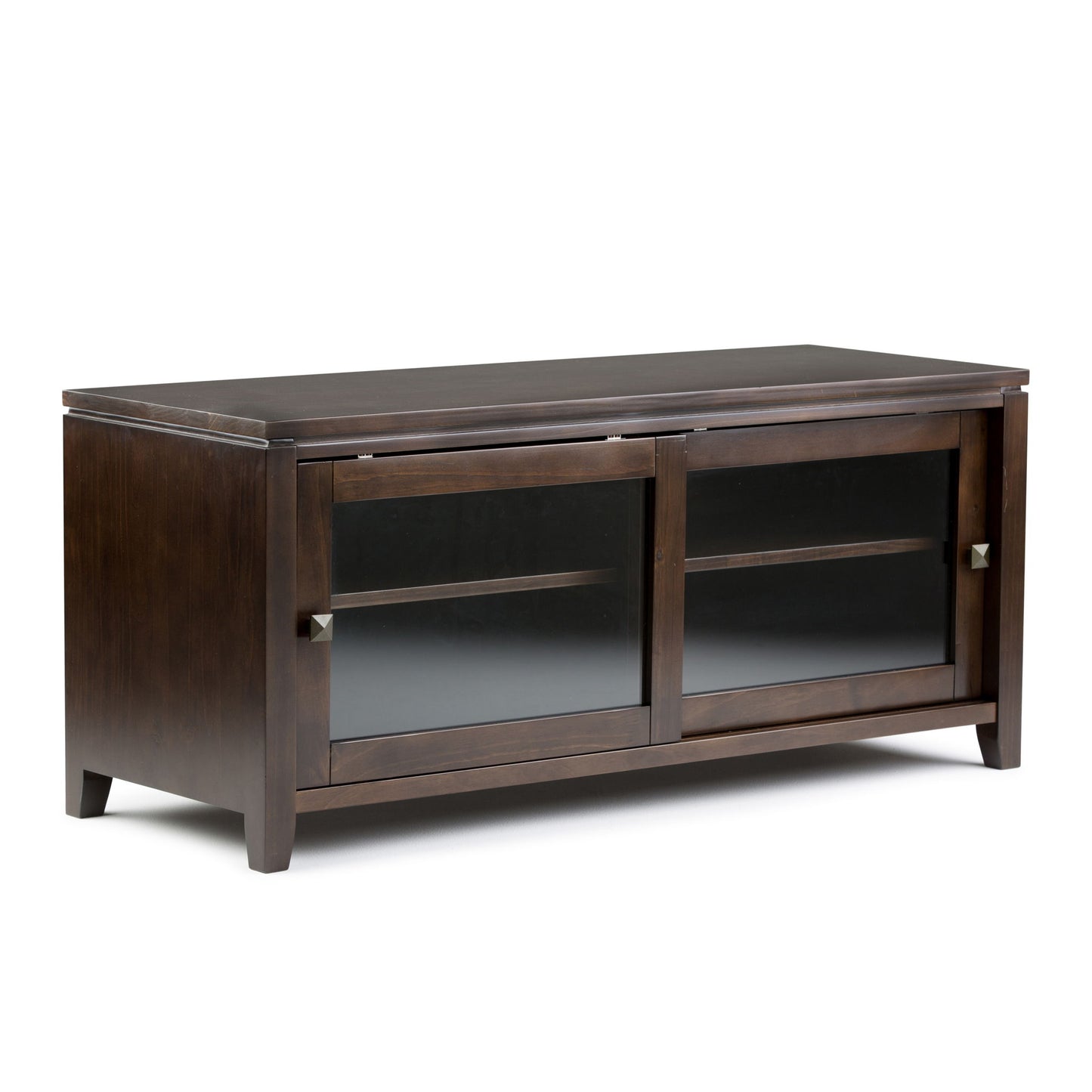 The Cosmopolitan Handcrafted TV Media Stand features dark wood, two sliding glass doors with square metal handles, an interior shelf, and short legs. Its modern, simple design is ideal for any living room or media setup.