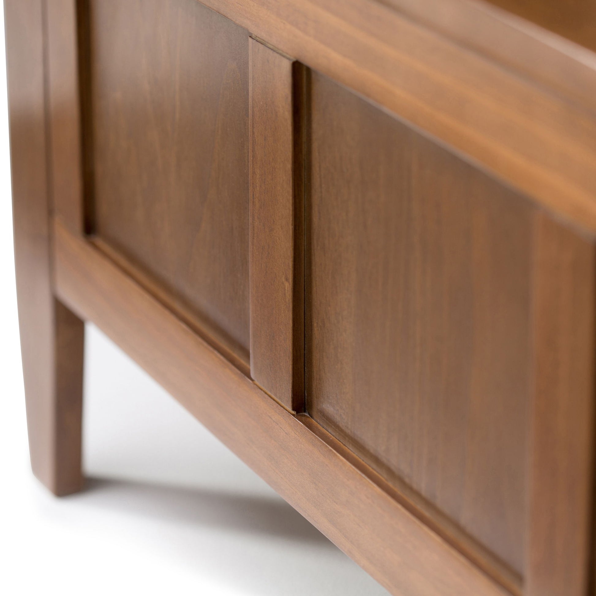 Close-up of the Brooklyn Entryway Storage Bench in Medium Saddle Brown, showcasing its smooth finish, paneled detailing, clean lines, and sturdy legs.