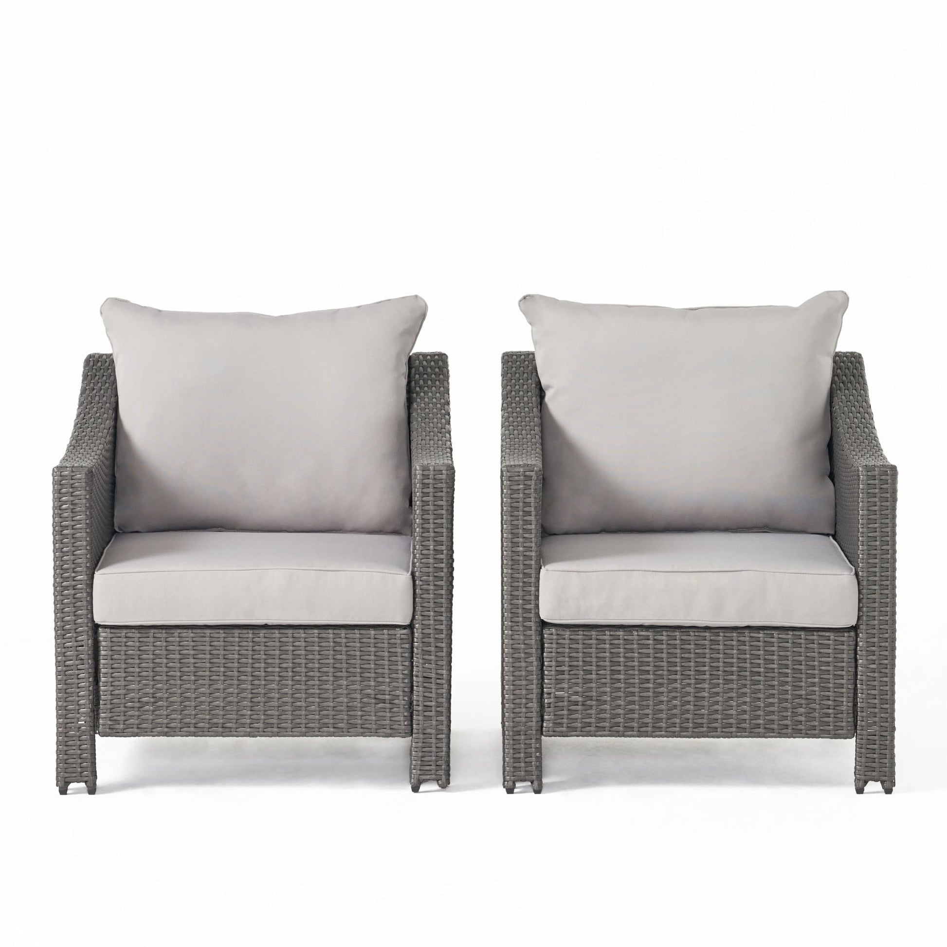 Two Antibes armchairs with woven rattan-style frames and water-resistant light gray cushions are placed side by side against a plain white background.
