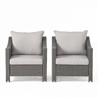 Two Antibes armchairs with woven rattan-style frames and water-resistant light gray cushions are placed side by side against a plain white background.