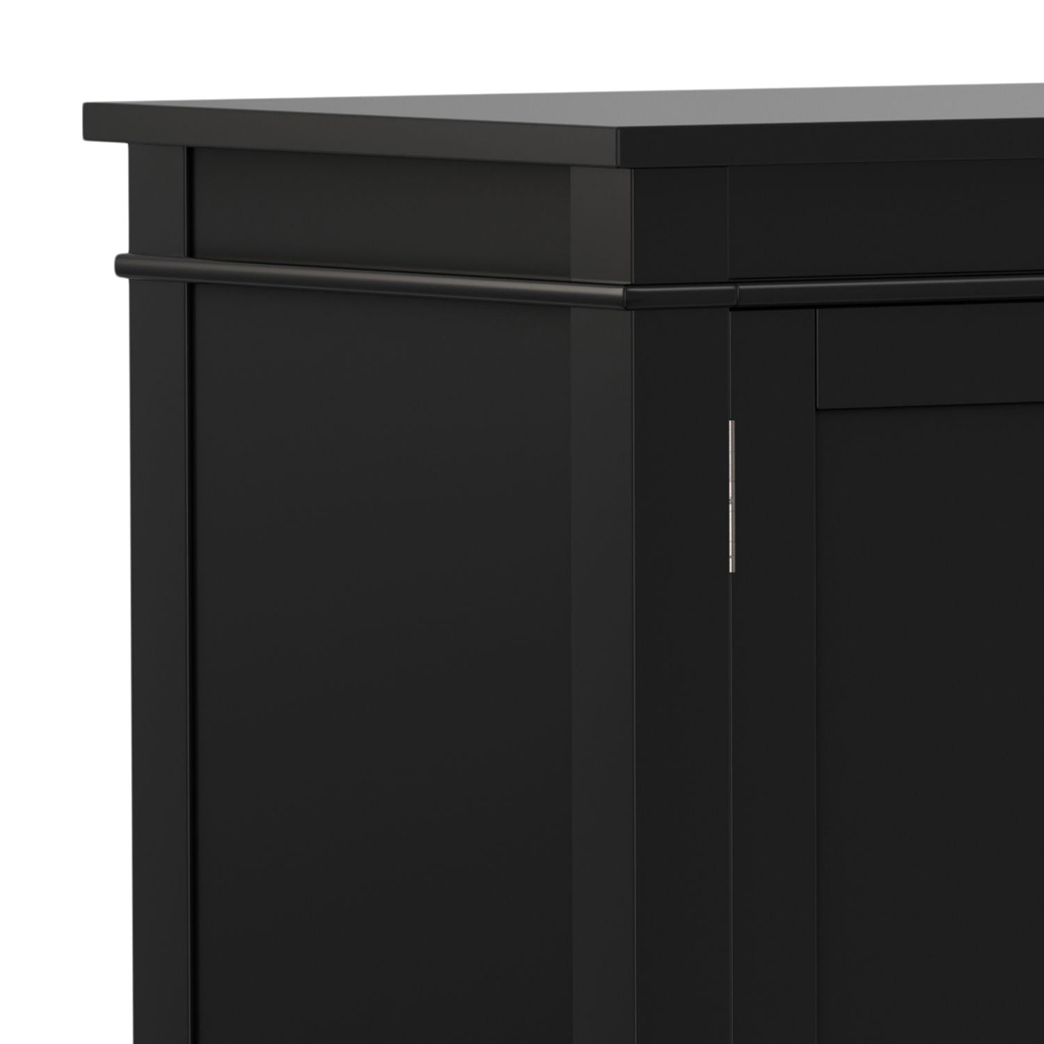 Close-up of the top corner of the Carlton - TV Media Stand, showcasing its black finish, clean lines, smooth surface, simple modern design, and a slightly overhanging top panel.