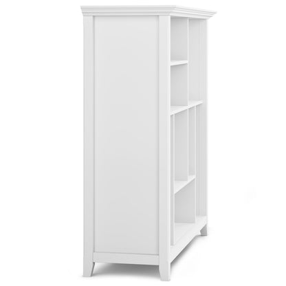 The Amherst - Multi Cube Bookcase And Storage Unit is a white, tall bookcase with multiple square shelves, open front, modern simple design, four legs, and shown from an angled side view.