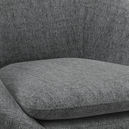 Close-up of the Redding - Upholstered Accent Chair, highlighting its gray fabric seat cushion, curved armrest, and backrest. The subtly textured upholstery looks soft and comfortable.