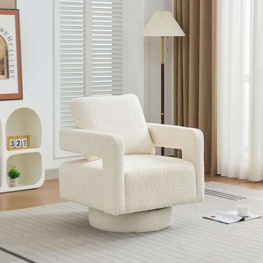 The Square Swivel Accent Chair, a modern beige armchair with an open back and removable cushion, features 360° rotation and sits in a bright living room beside a floor lamp, shelves, framed art, and a magazine on the rug.