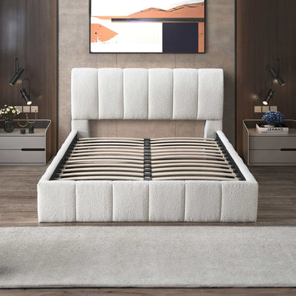 A modern bedroom showcases the Hilar - Elegant Design Platform Bed in white upholstery (shown without a mattress), complemented by matching nightstands, lamps, flowers, books, and abstract art above a wood-paneled wall.