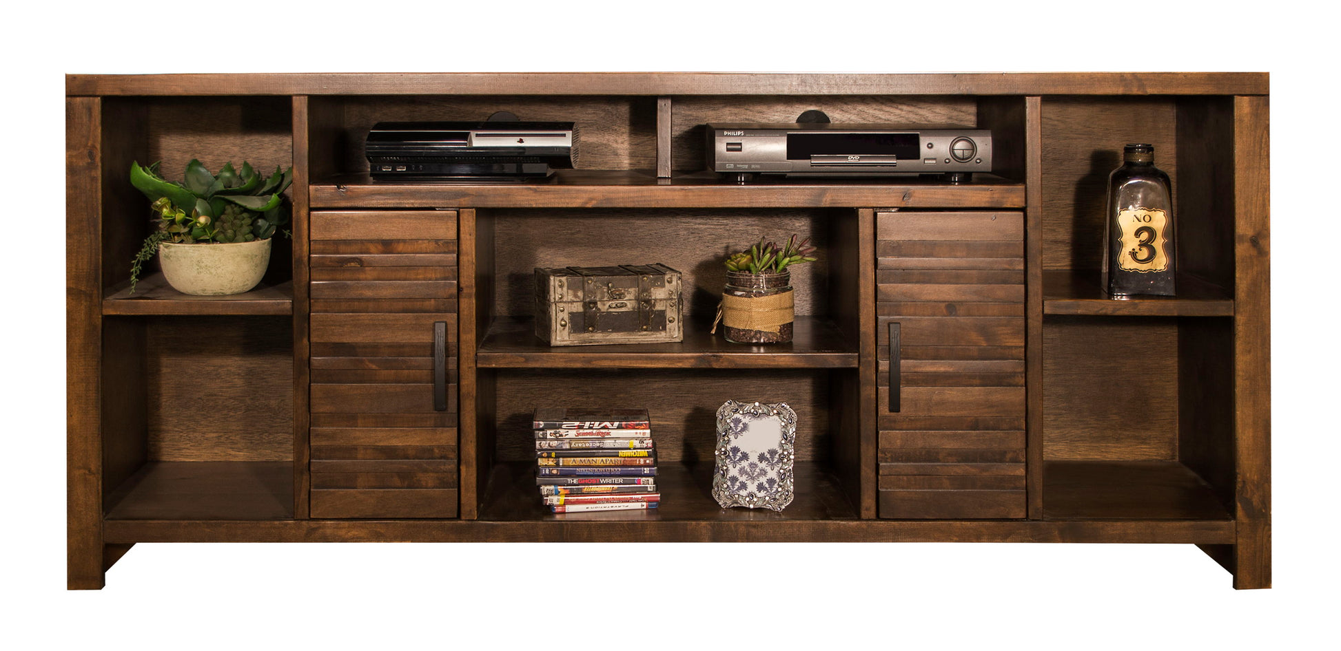 The Sausalito TV Stand Console features a dark wood finish, open shelves for a plant, electronics, books, DVDs, and décor, plus two central cabinet doors for concealed storage.