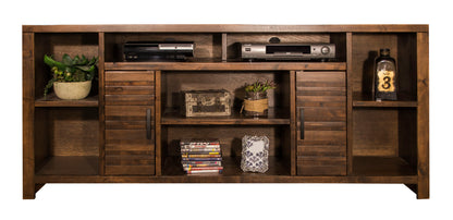 The Sausalito TV Stand Console features a dark wood finish, open shelves for a plant, electronics, books, DVDs, and décor, plus two central cabinet doors for concealed storage.