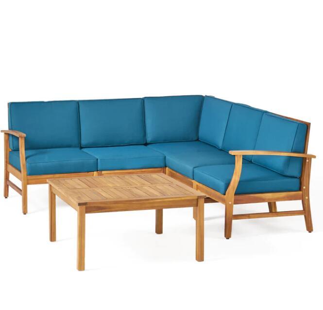 The Perla - 6 Pieces Sofa Set features a wooden L-shaped outdoor sectional with blue cushions and armrests, paired with a matching rectangular coffee table.