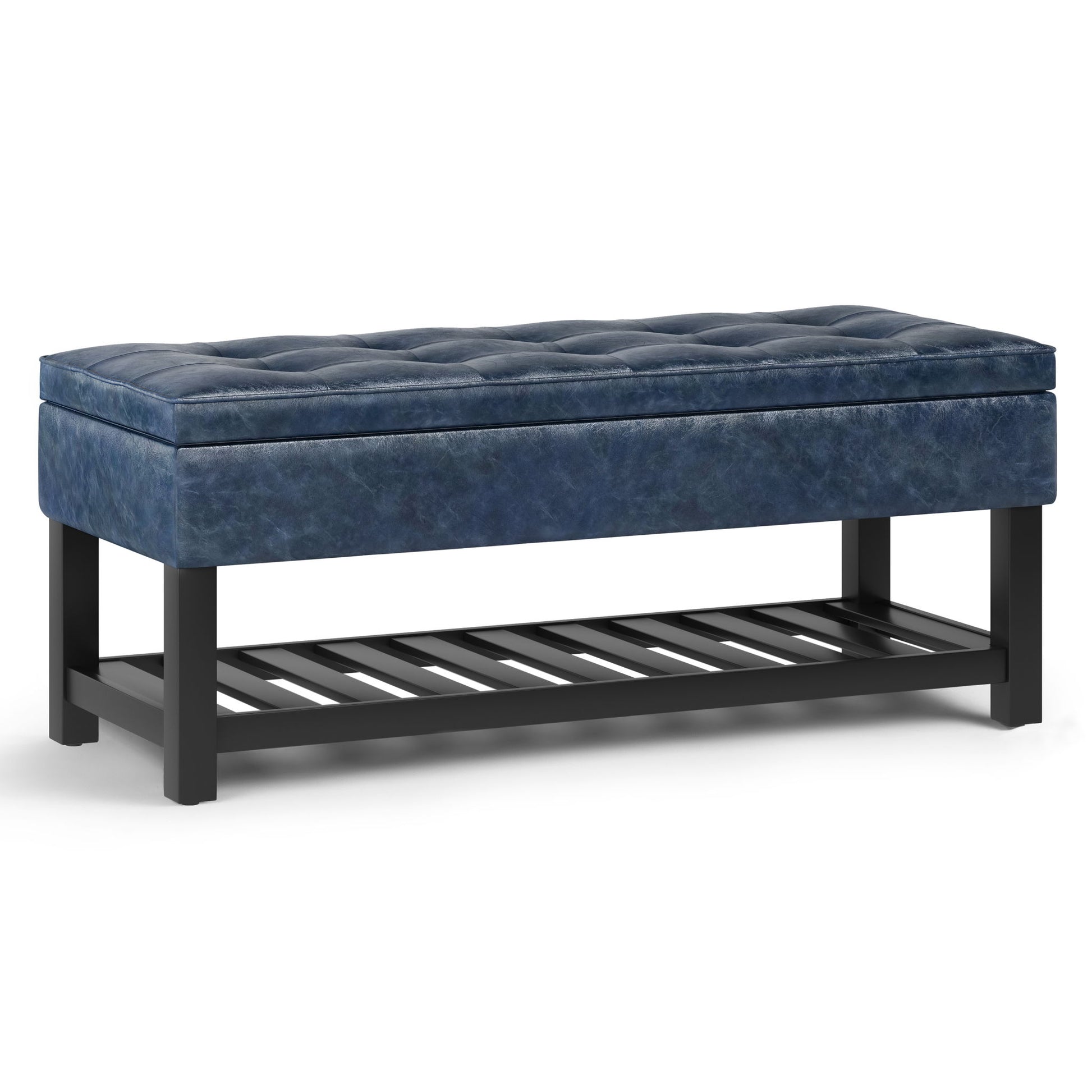 The Cosmopolitan Storage Ottoman Bench features a rectangular blue tufted cushioned seat, black wooden legs, and an open slatted shelf underneath for added storage.