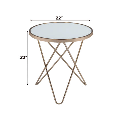 The Valora - Glass Coffee Table features a round glass top, gold metal frame with crisscross legs, and measures 22 inches in both height and diameter, as shown by labeled arrows.