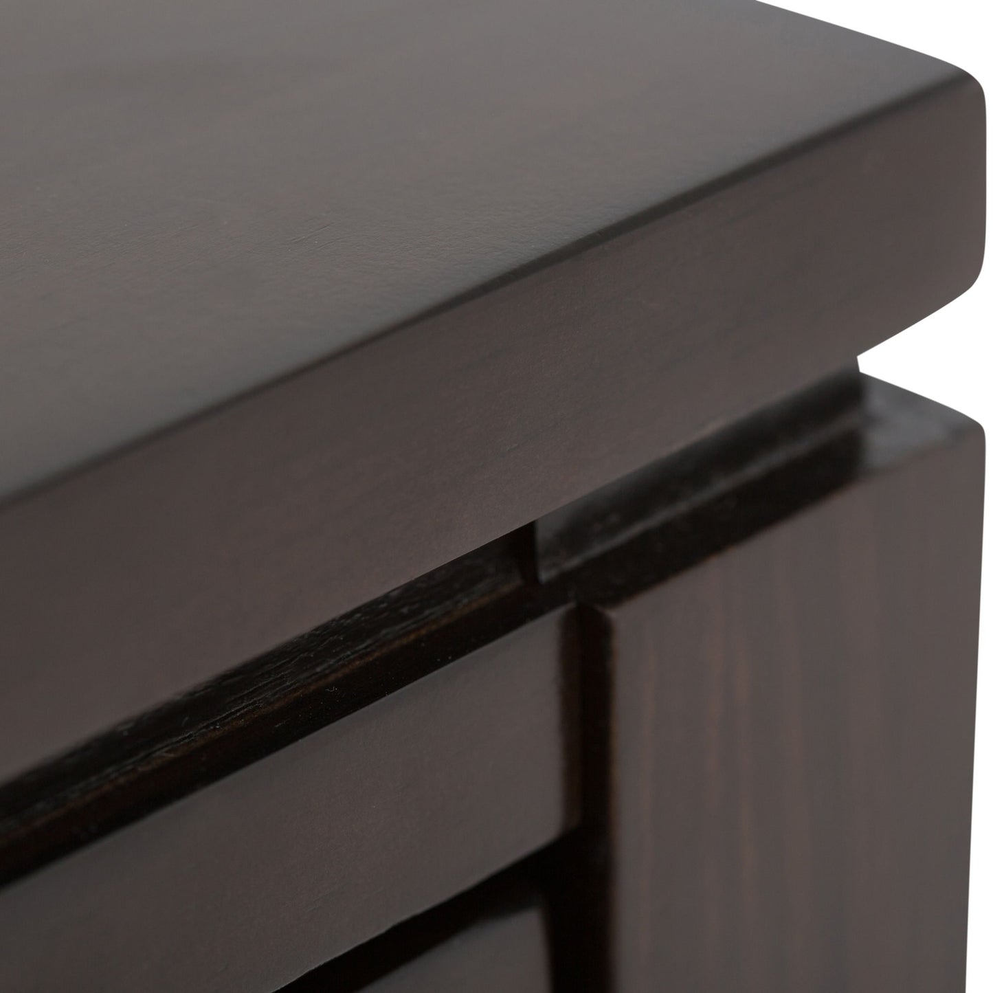Close-up of the corner of the Cosmopolitan Multipurpose Table, highlighting its dark wood finish, smooth polished surfaces, and sharp edges.