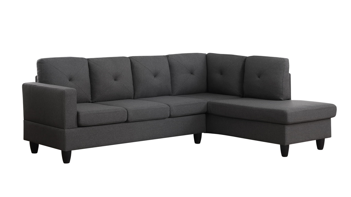 The Santiago Linen Sectional Sofa features a dark gray L-shape design with tufted seat and back cushions, short black legs, and a right-facing chaise lounge.