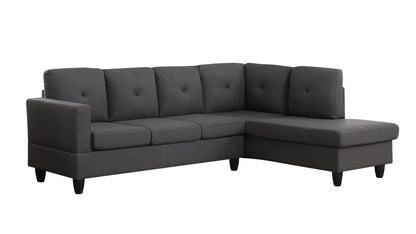 The Santiago Linen Sectional Sofa features a dark gray L-shape design with tufted seat and back cushions, short black legs, and a right-facing chaise lounge.