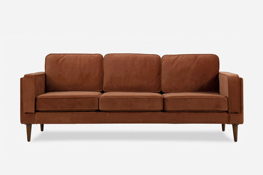 The Albany Sofa is a brown three-seater with square cushions, an upright backrest, straight arms, and wooden legs, shown against a plain white background.