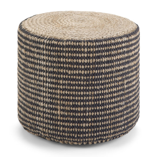 The Larissa Handcrafted Round Braided Pouf features a woven texture, black and natural tan checkerboard sides, and a spiral pattern on top.