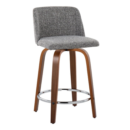 The Toriano set includes two mid-century modern, fixed-height counter stools featuring curved wooden frames, a chrome round footrest, padded seats and backrests upholstered in gray fabric, with legs slightly angled outward.