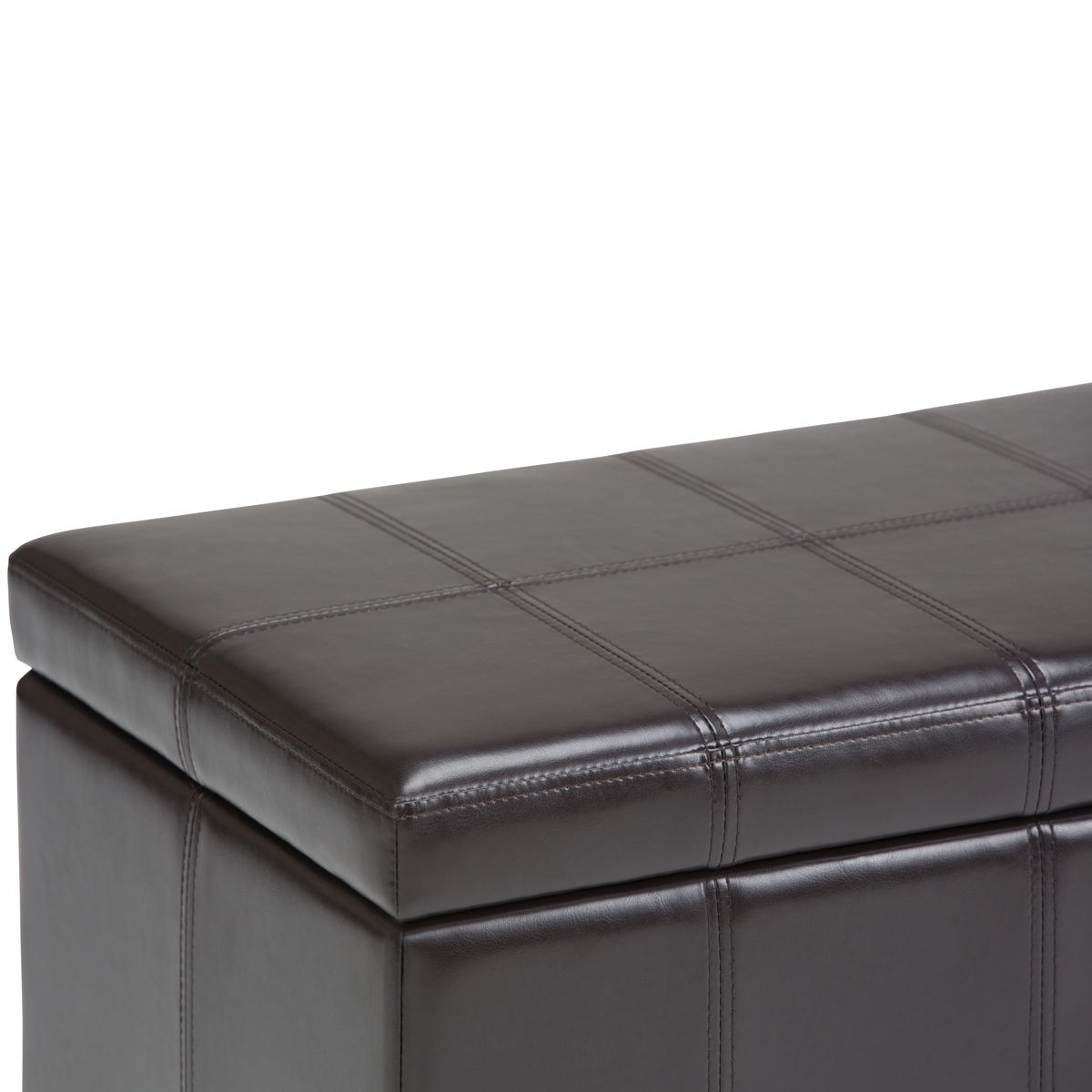A close-up of the Amelia - Transitional Storage Ottoman Bench in dark brown faux leather, featuring square-patterned stitching on the cushioned lid. The bench is slightly open at the top to reveal storage space inside.