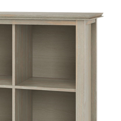 A close-up of the Artisan - Cube Storage shelving unit in light wood finish, featuring four cubes, a textured surface, and clean, straight lines at the right upper corner.
