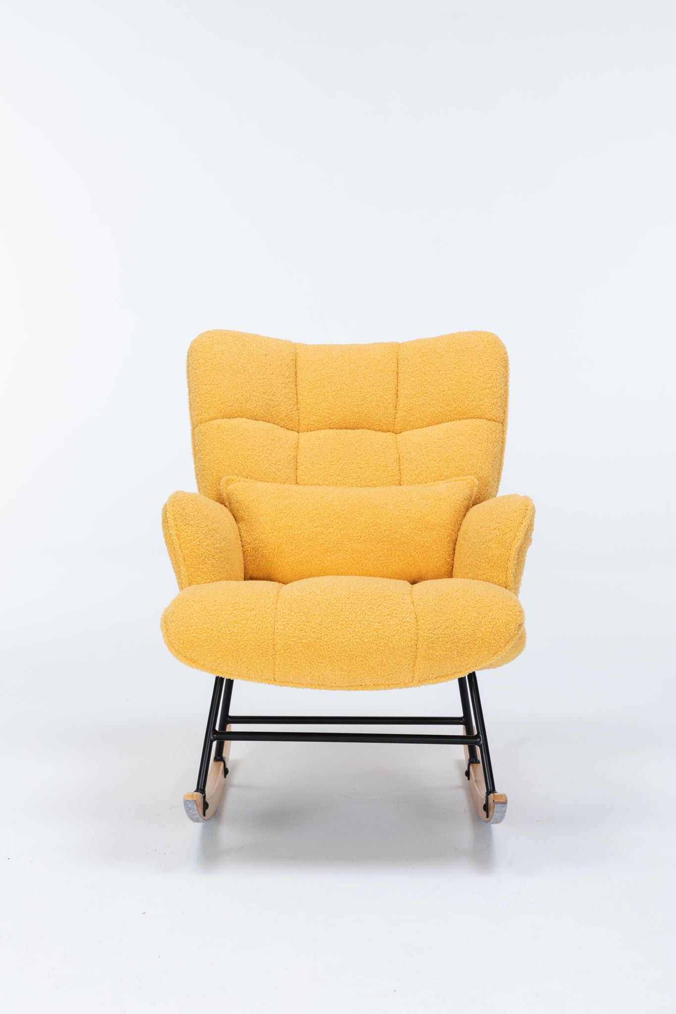 The Rocking Chair Nursery is a yellow teddy upholstered glider rocker with a high backrest and matching pillow, featuring a black metal frame and wooden rocker legs, perfect for living rooms or nurseries.