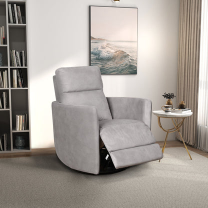 A modern living room featuring the Lawson Swivel Glider Suede Recliner Chair in Latte, a round white side table with gold legs, books, a small plant, bookshelf, large ocean artwork, and natural light streaming through sheer curtains.