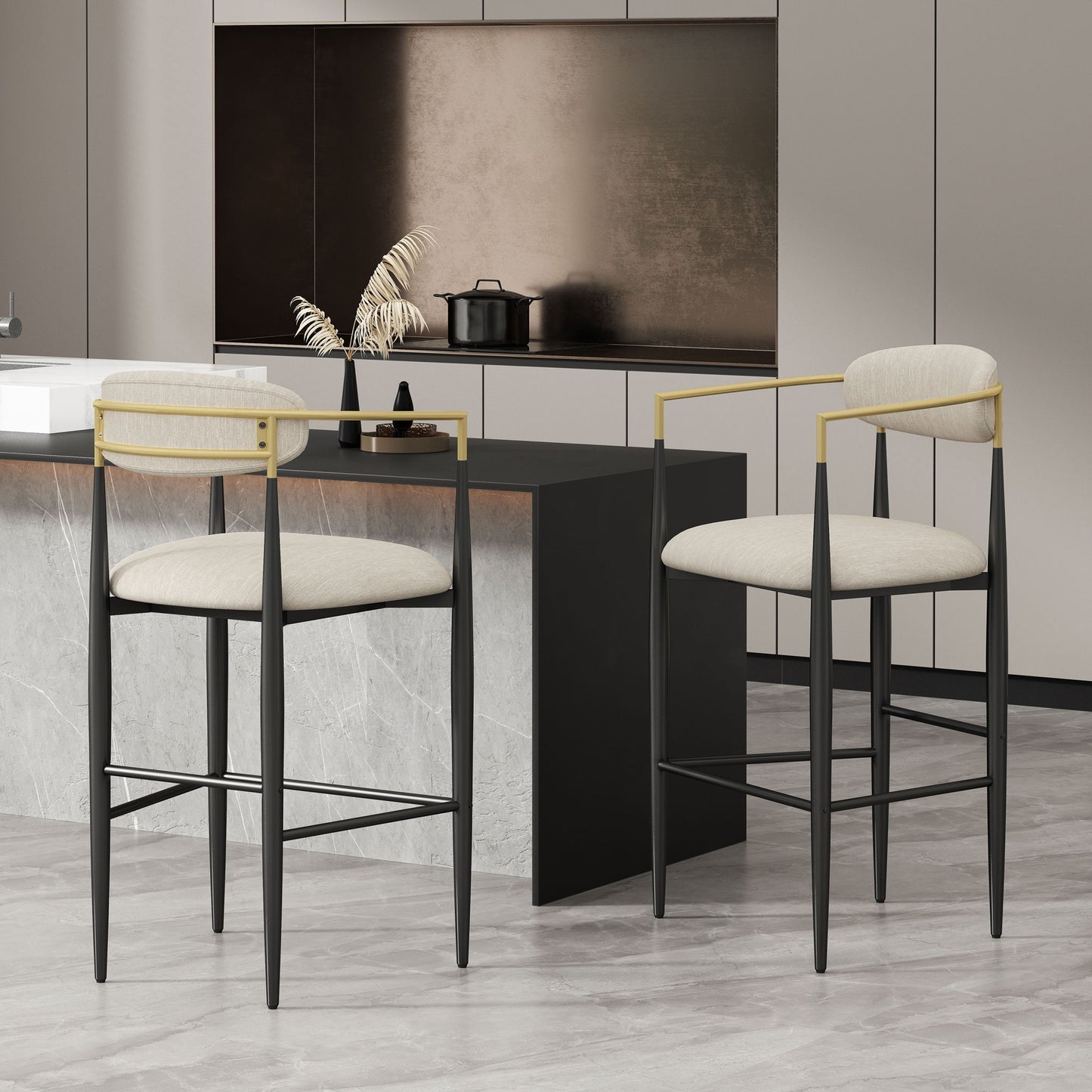 A set of two Counter Height Upholstered Barstools with black frames, gold armrests, and beige cushions sits by a marble kitchen island in a minimalist space with neutral cabinets and a decorative vase.