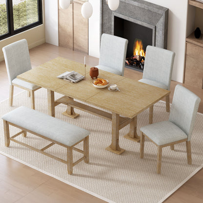 The Topmax 6 Piece Farmhouse Extendable Dining Table Set, with removable leaf, upholstered chairs and bench, sits on a cream rug in a cozy room set for tea by the fireplace and large window.
