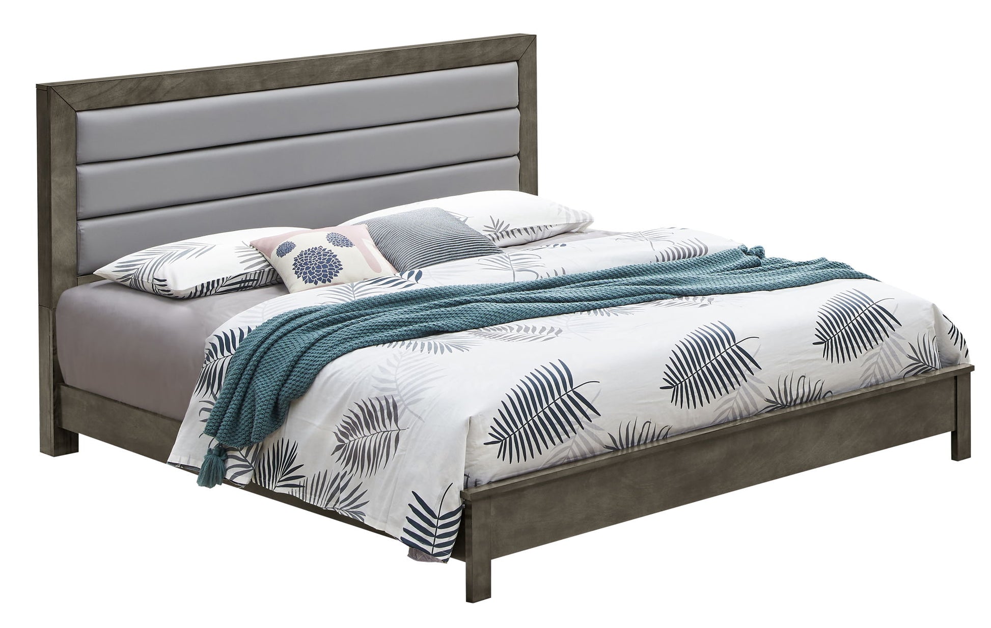 The Transitional Modern Design Bed features a gray padded headboard, white and gray leaf-patterned bedding, a teal knit throw blanket, and several pillows including one with a floral design.