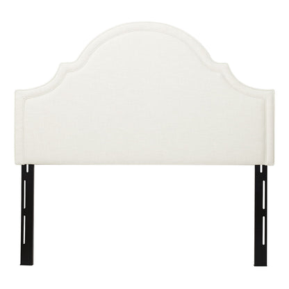 The Catherine - Luxurious Comfort Upholstered Headboard features cream upholstery, a curved scalloped top, and black metal support legs, displayed against a white background.