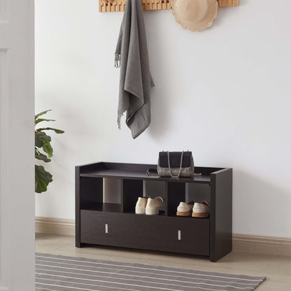 A Shoe Entry Bench With Three Shelves and One Drawer With Divided Compartment holds shoes and a purse. Above it, a wooden wall rack displays a gray scarf and tan hat. A plant and striped rug are nearby.