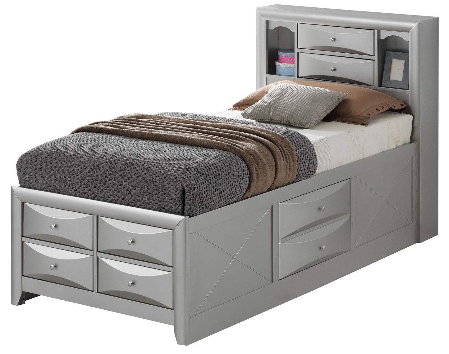 The Marilla Storage Bed With Bookcase Headboard in gray features drawers beneath the mattress, shelves and small drawers in the headboard, and is styled with neatly arranged gray, brown, and white bedding plus several pillows.