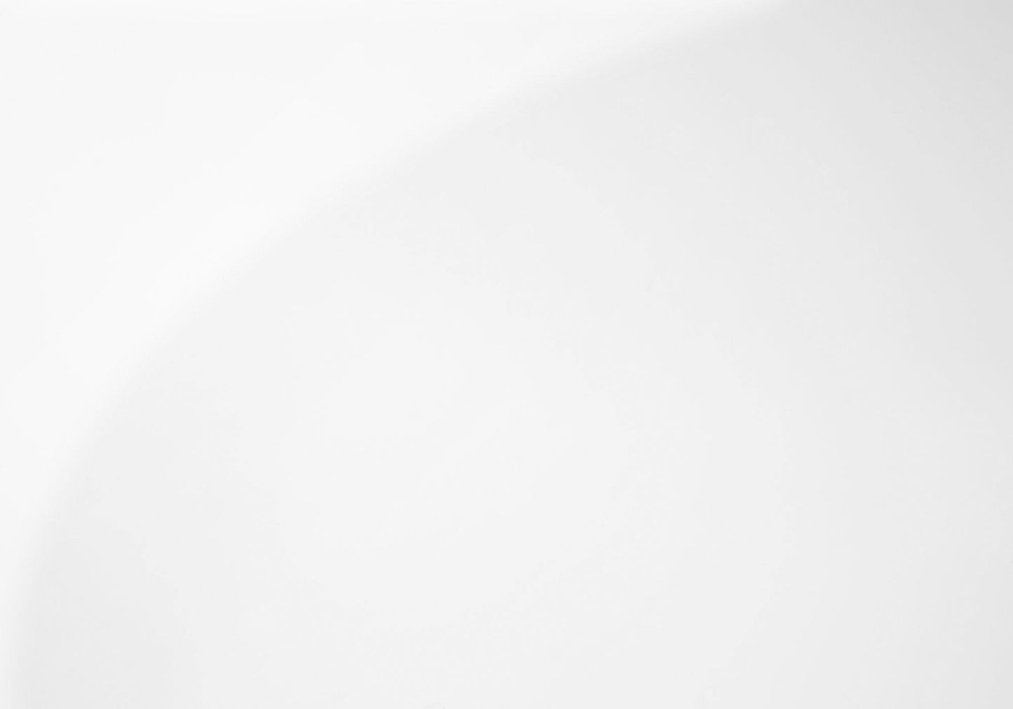 A minimalistic image featuring the Coffee Table Rectangular For Living Room Clear Tempered Glass on a smooth white background with a faint, curved shadow or gradient in the upper right corner.