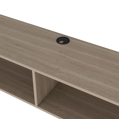 A close-up of the Moore - Floating TV Stand, featuring cubby-style compartments and a black circular cable management grommet on the top surface.