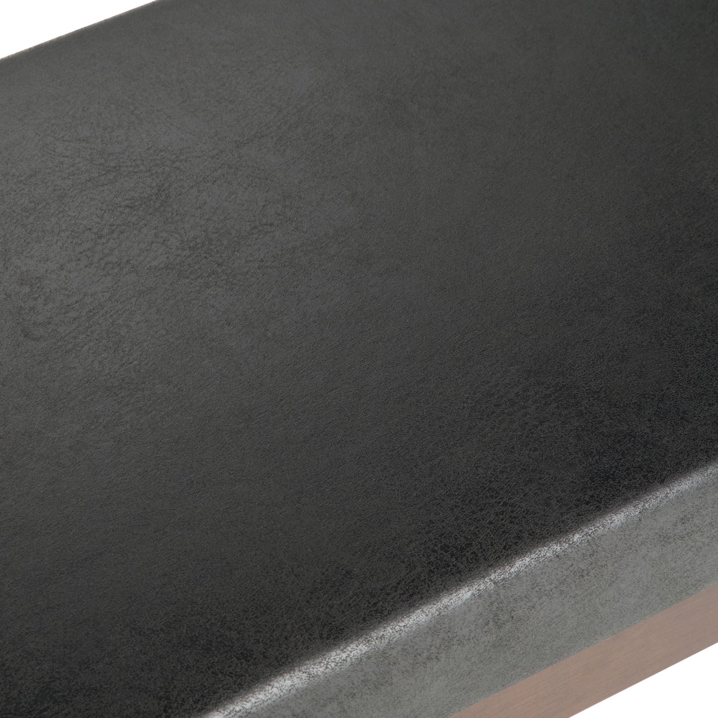 Close-up of the smooth, slightly textured black faux leather surface on the Chanelle Mid-Century Ottoman Bench.