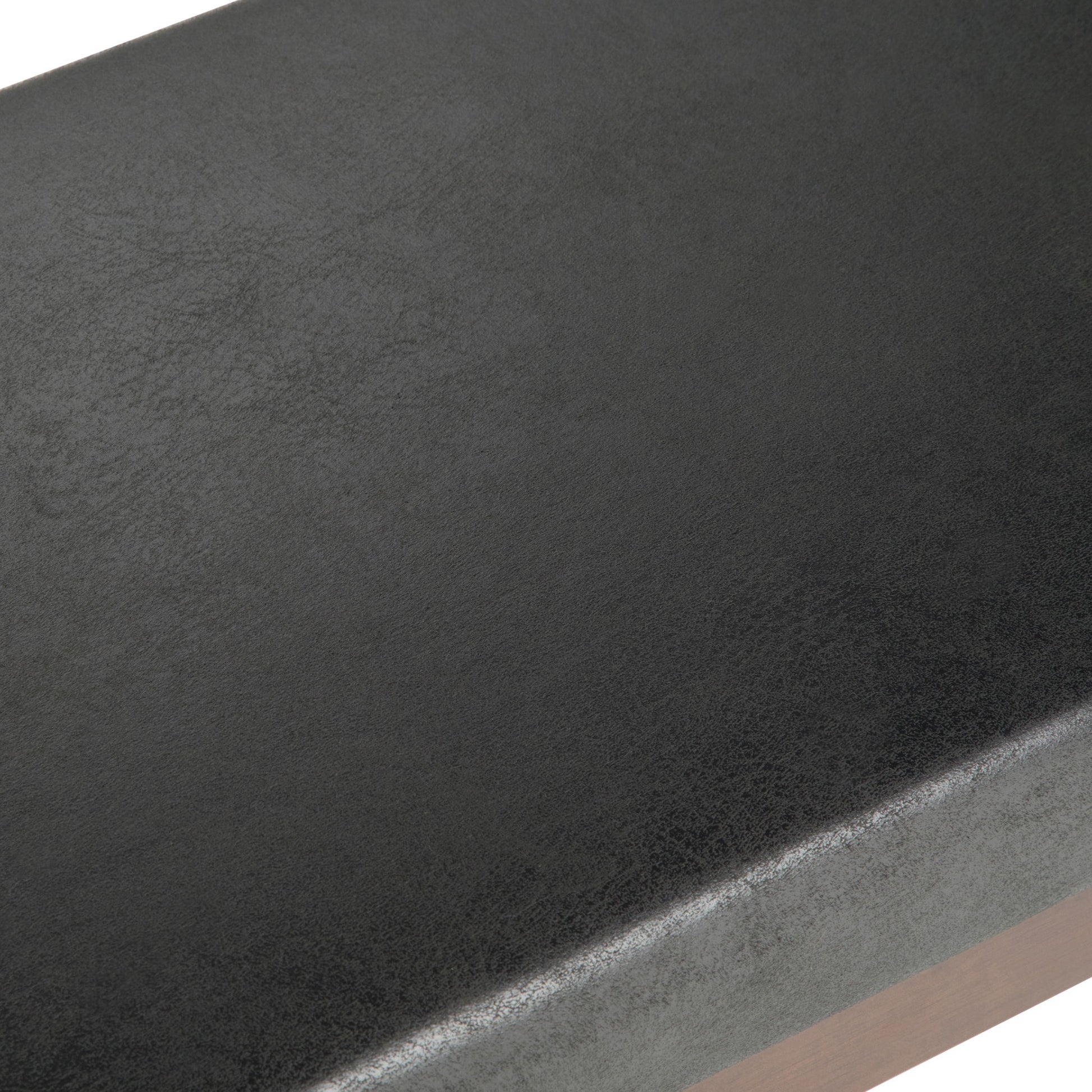 Close-up of the smooth, slightly textured black faux leather surface on the Chanelle Mid-Century Ottoman Bench.