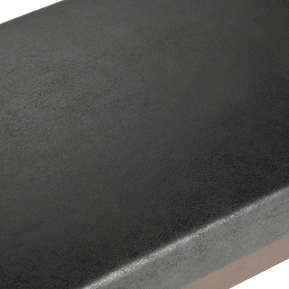 Close-up of the smooth, slightly textured black faux leather surface on the Chanelle Mid-Century Ottoman Bench.