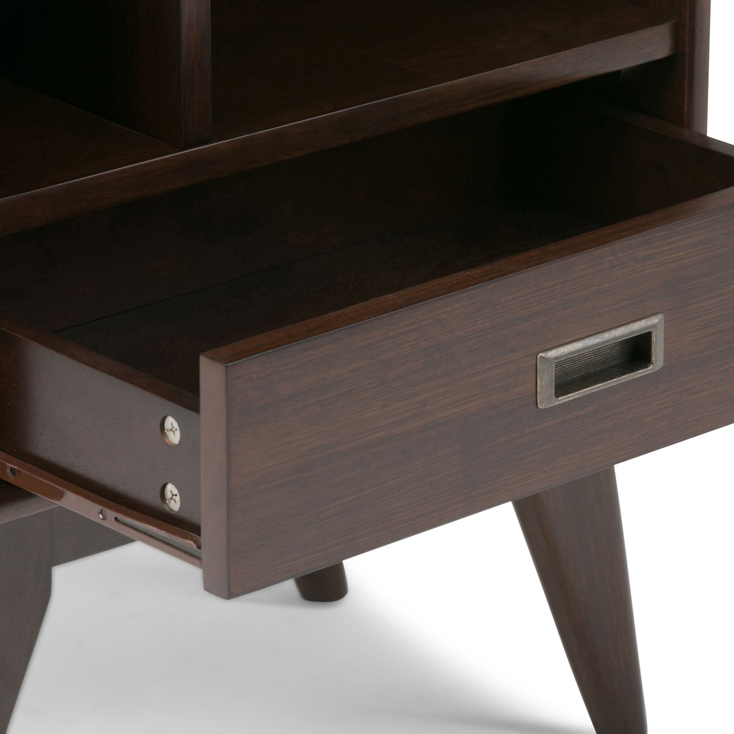 A close-up of the Draper Mid Century Wide Bookcase and Storage Unit shows its dark wood finish, open drawer, angled legs, and a rectangular metal handle on the drawer front.
